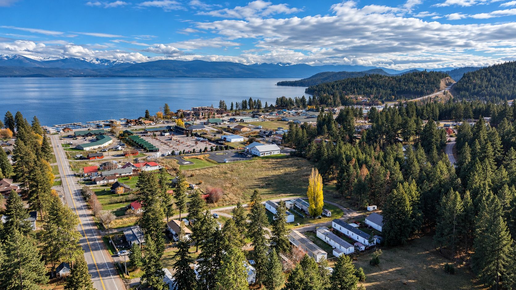 Aerial view of a lakeside town on a large mountain lake